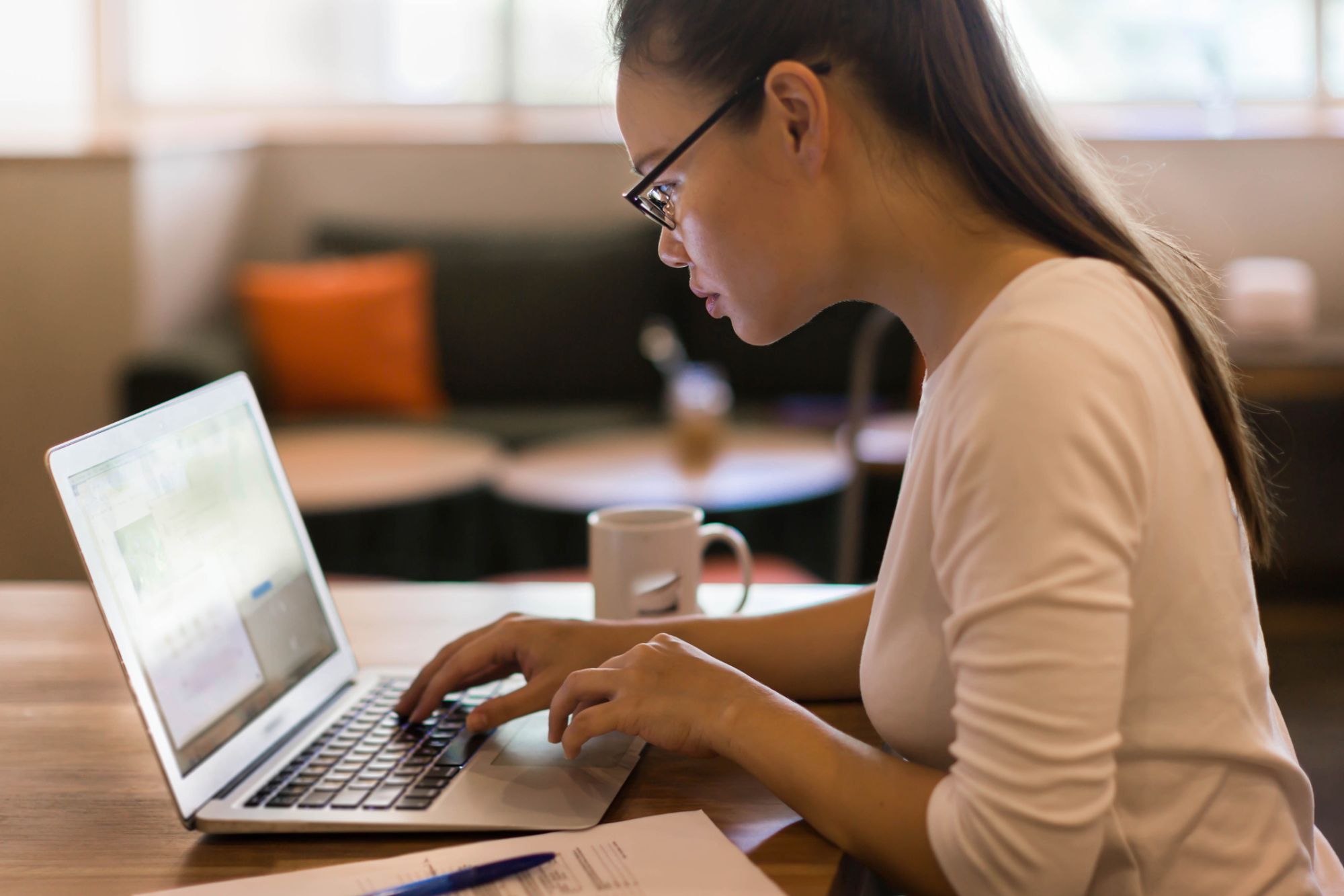 woman on laptop typing